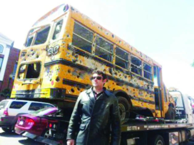 Bullet-riddled bus uses art asa message