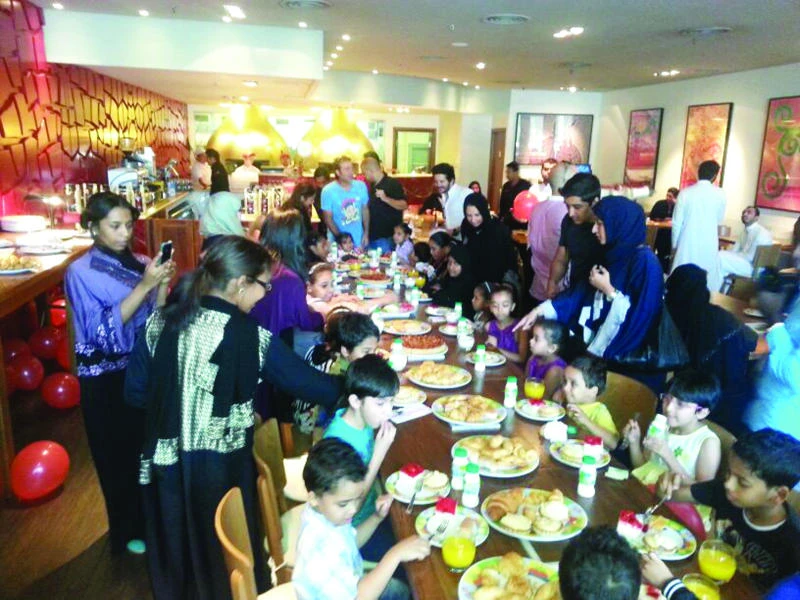 Orphans enjoy breakfast with Jeddah Backpackers