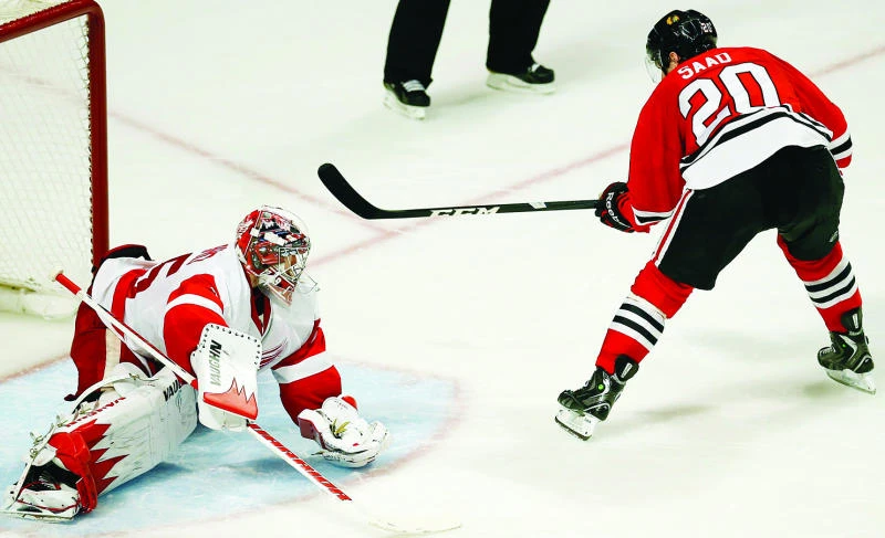 Blackhawks clinch division with SO win over Wings