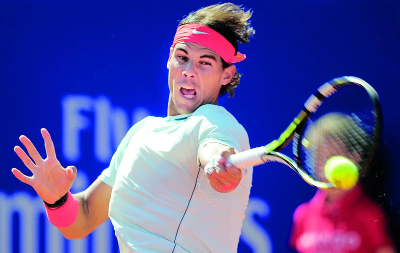 Ferrer falls by the wayside, Nadal eases through