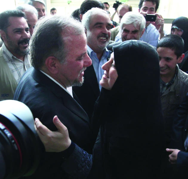 Iranian scientist released by US returns home