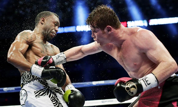 Alvarez unifies 154-pound boxing titles, beating Trout