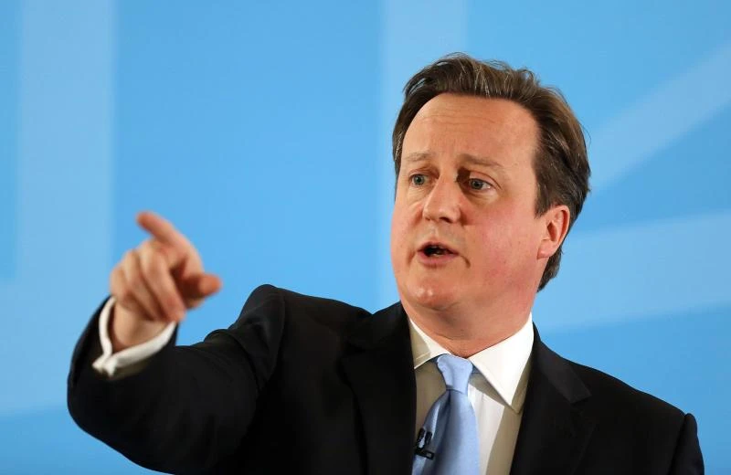 Waist-deep in mud, British PM rescues distressed sheep