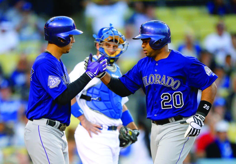 Rockies rake Dodgers for 19 hits in 12-2 rout