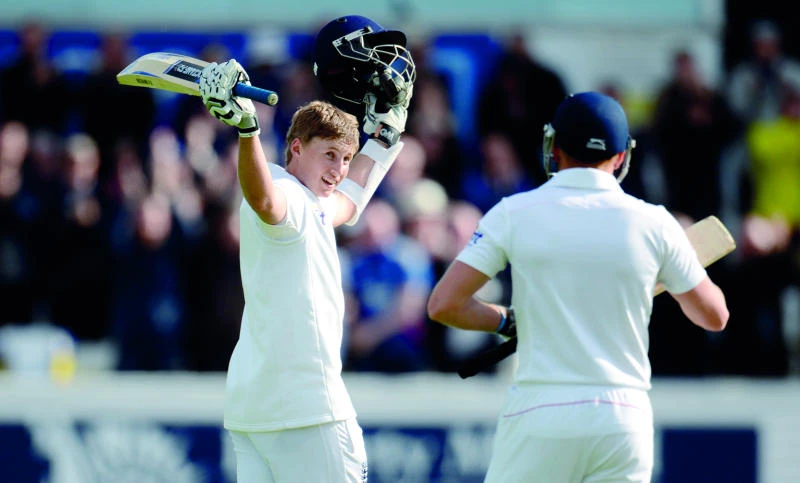 Root boosts England with maiden Test century