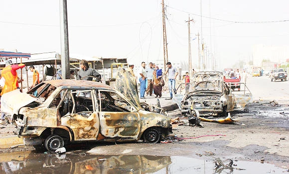Wave of attacks kills at least 95 in Iraq