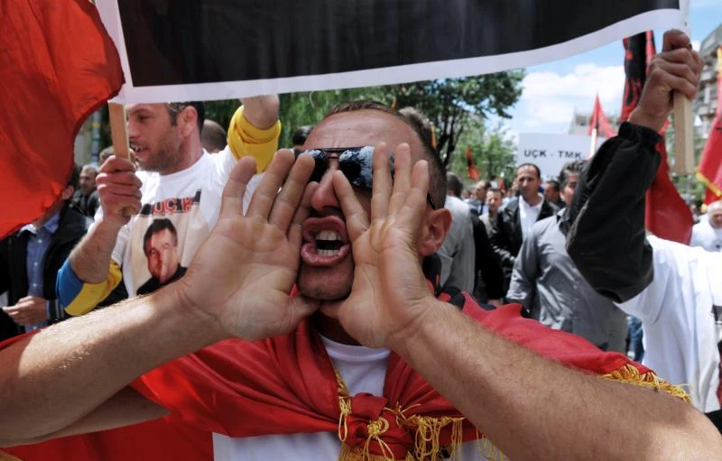 Thousands protest arrest of 6 ex-rebels
