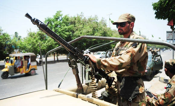 As Pakistan votes, the military watches from its barracks