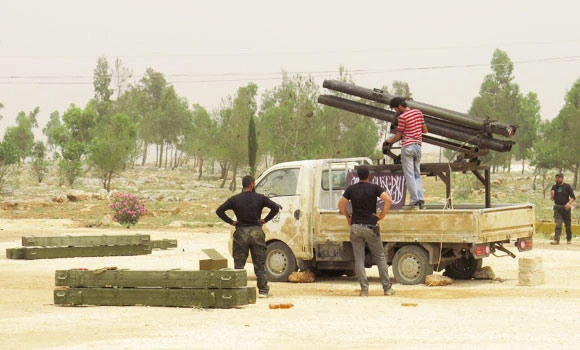 Syrian fighters, regime battle for highways