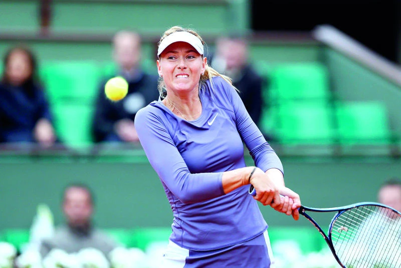 Nadal rallies; Serena, Sharapova sail in Paris