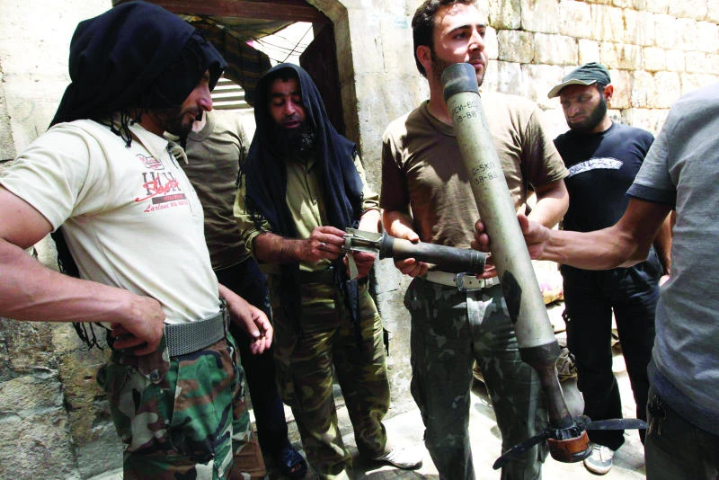 Syrian fighters, Hezbollah militia clash on Lebanon soil