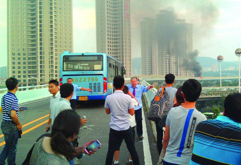 Suspect named in China bus fire