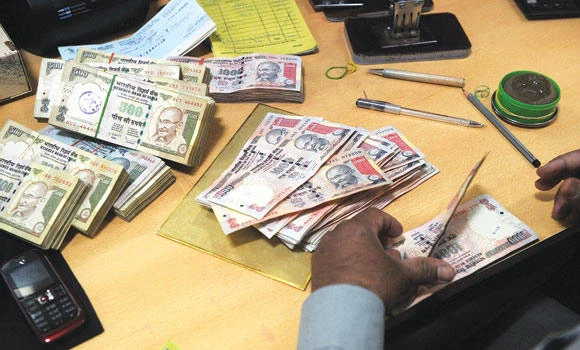 India plans action to curb rupee’s fall