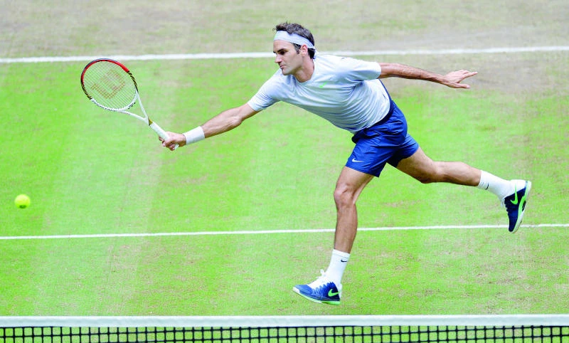 Federer avenges 2012 Halle defeat by Haas
