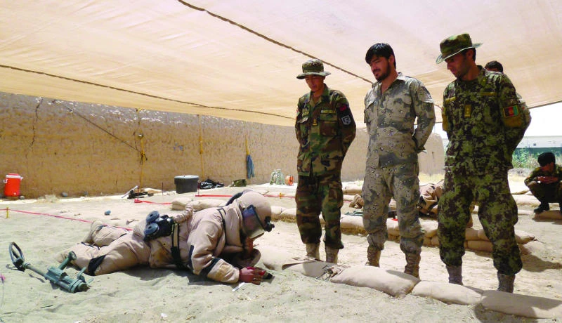 Afghans rush to learn risky art of defusing bombs