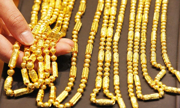 Gold surges 2% on dollar slide