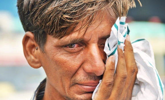 Mass cremations for India’s flood victims