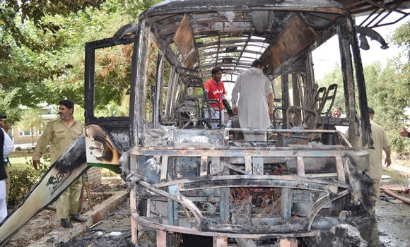 Pakistan gunmen blow up bus carrying female students, attack rescuers