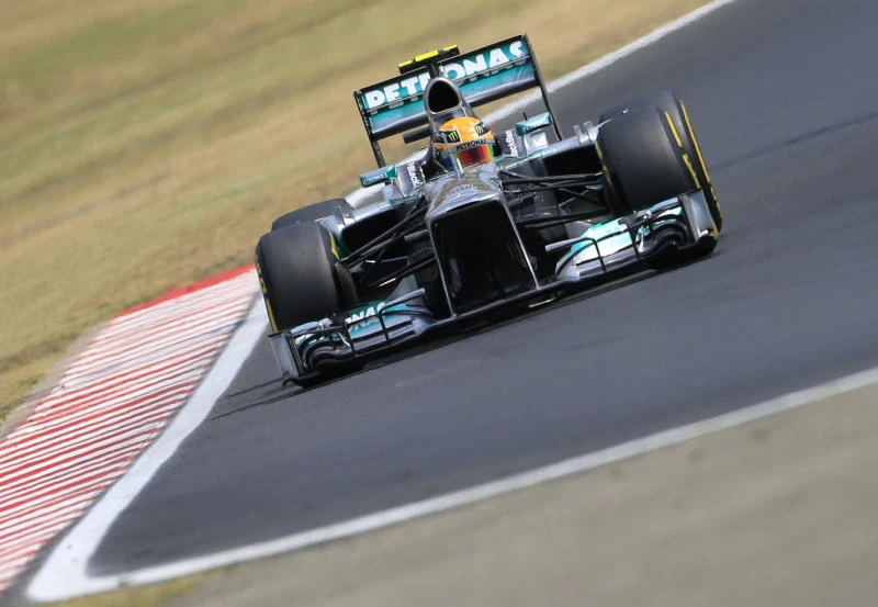 Hamilton scorches to third pole in a row