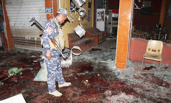 Suicide bomber strikes Iraq cafe as attacks kill 47
