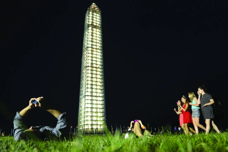Washington Monument is bathed in light