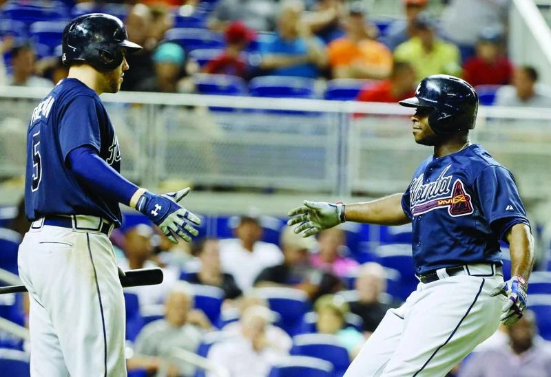 Justin Upton leads Braves past Marlins 6-4
