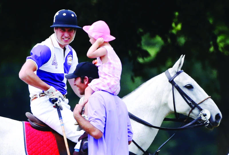 Prince William plays polo as baby watch heats up