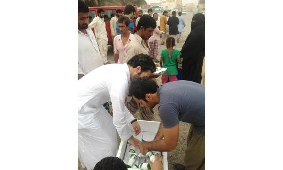 Youth distribute food among the needy