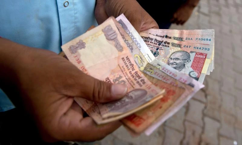 India’s rupee plunges to new low, stocks fall 3.85%