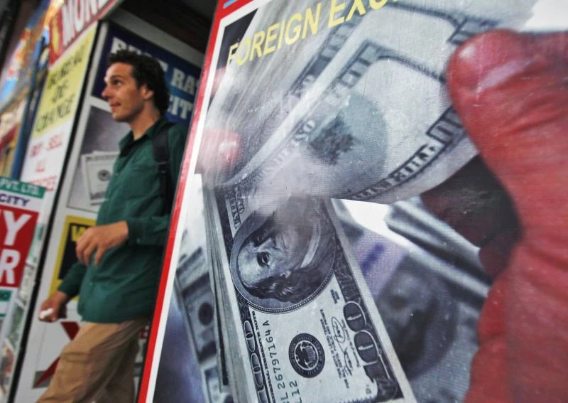 Dollar hits two-week peaks as US data fuels Fed taper talk