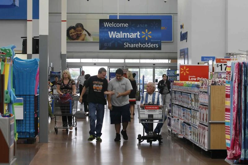 Wal-Mart cuts profit outlook on shopper worries
