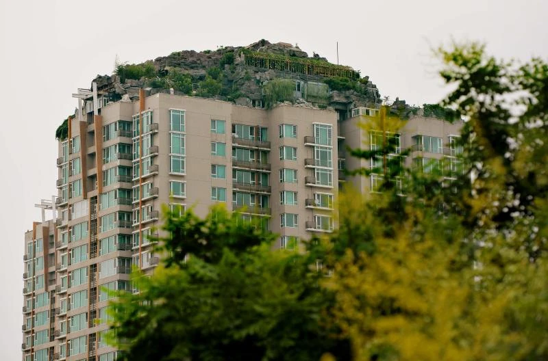 Beijing man builds rock villa on top of apartment tower