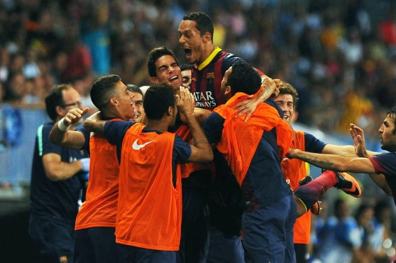 Barcelona struggles past Malaga without Messi