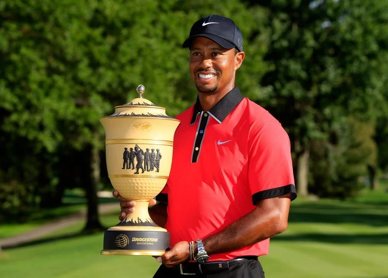 Woods coasts to 7-shot win for 8th Bridgestone title