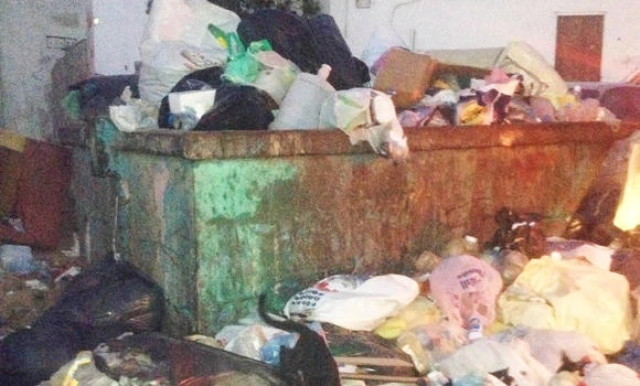 Overflowing dumpsters dampen festivities