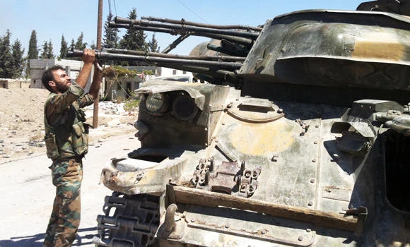 Syria says its army is ready, has ‘finger on trigger’