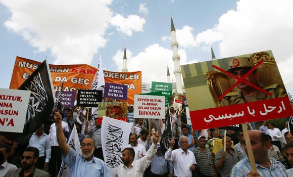 Turkey and Egypt recall envoys; pro-Mursi rallies worldwide
