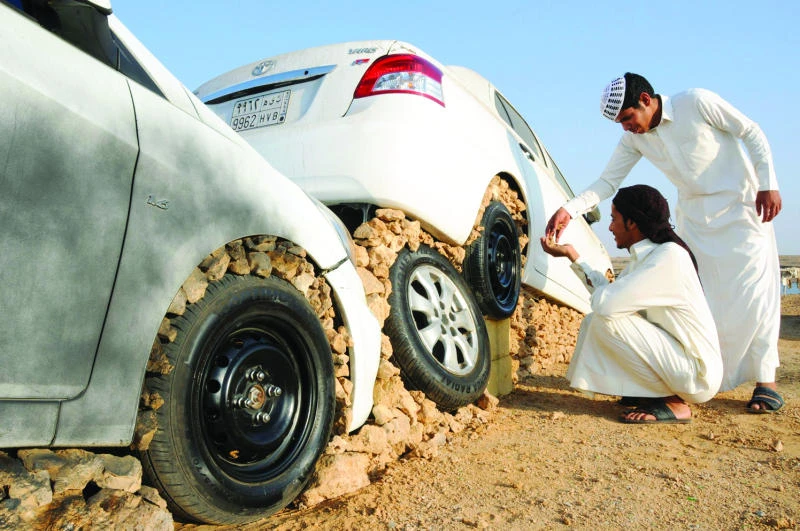 Is it art as young Saudis raise cars on stones?