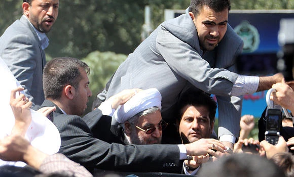Shoe thrown as Rowhani returns after Obama call