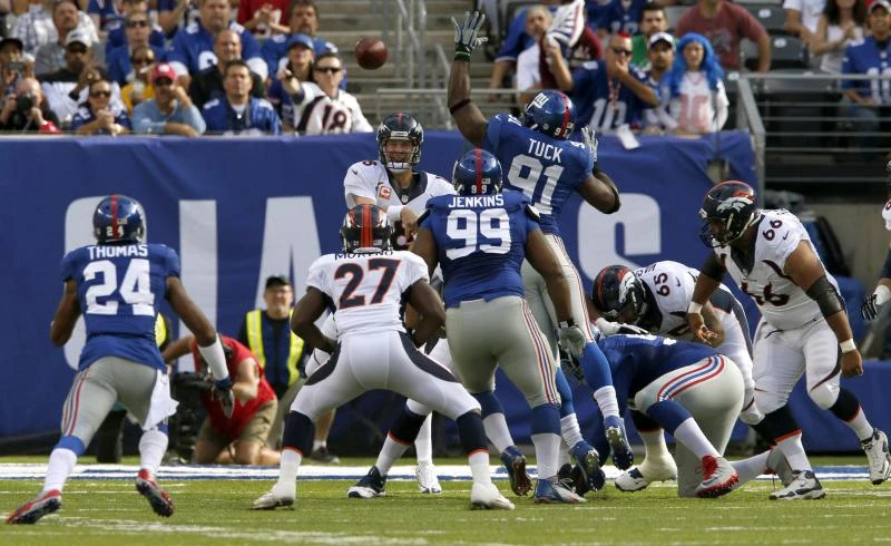 Peyton upstages Eli again, Broncos top Giants