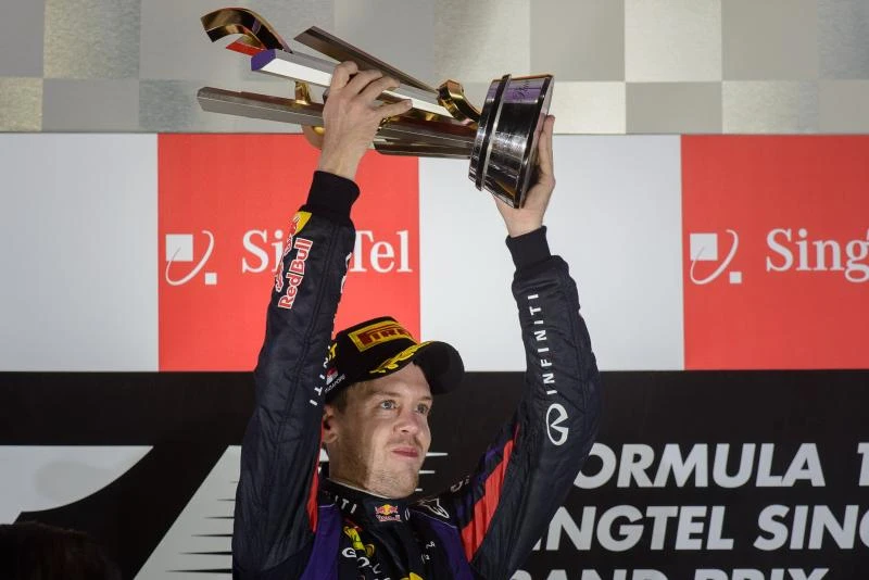 Untouchable Vettel roars to Singapore treble