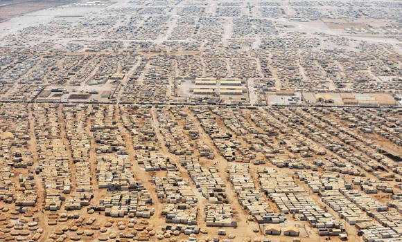 Syria refugees top 2 million, US argues for strike