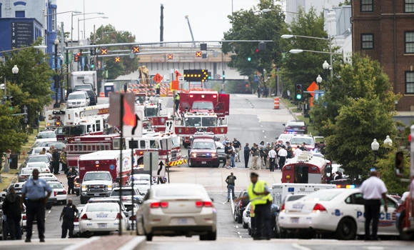 Police seek motive for deadly US naval base shooting