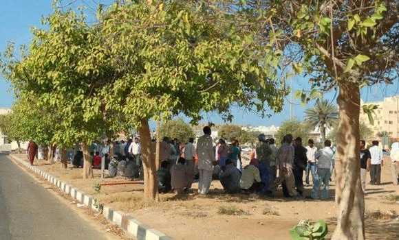 Unpaid for five months, 850 expats go on strike