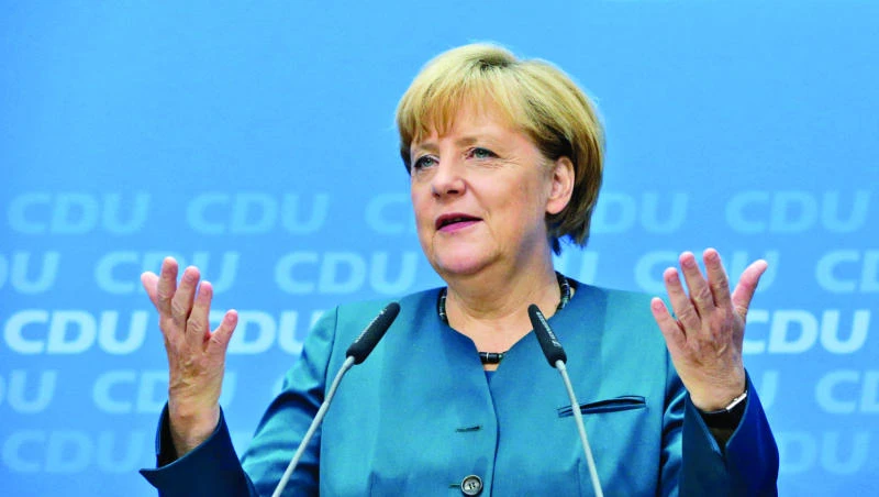 Merkel pushes for euro reforms after historic election victory
