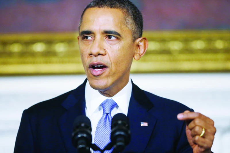 Obama blasts opponents as government reopens