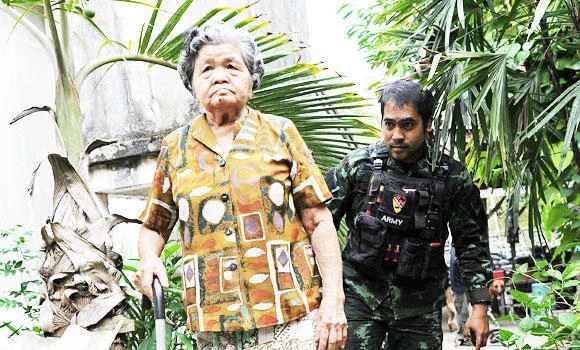 Widow holds out in war-torn Thai village