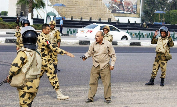3 policemen slain; player suspended for wearing MB T-shirt