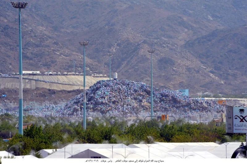 Pilgrims stand at Arafat