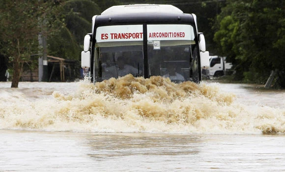 13 dead, millions without power as typhoon hits Philippines